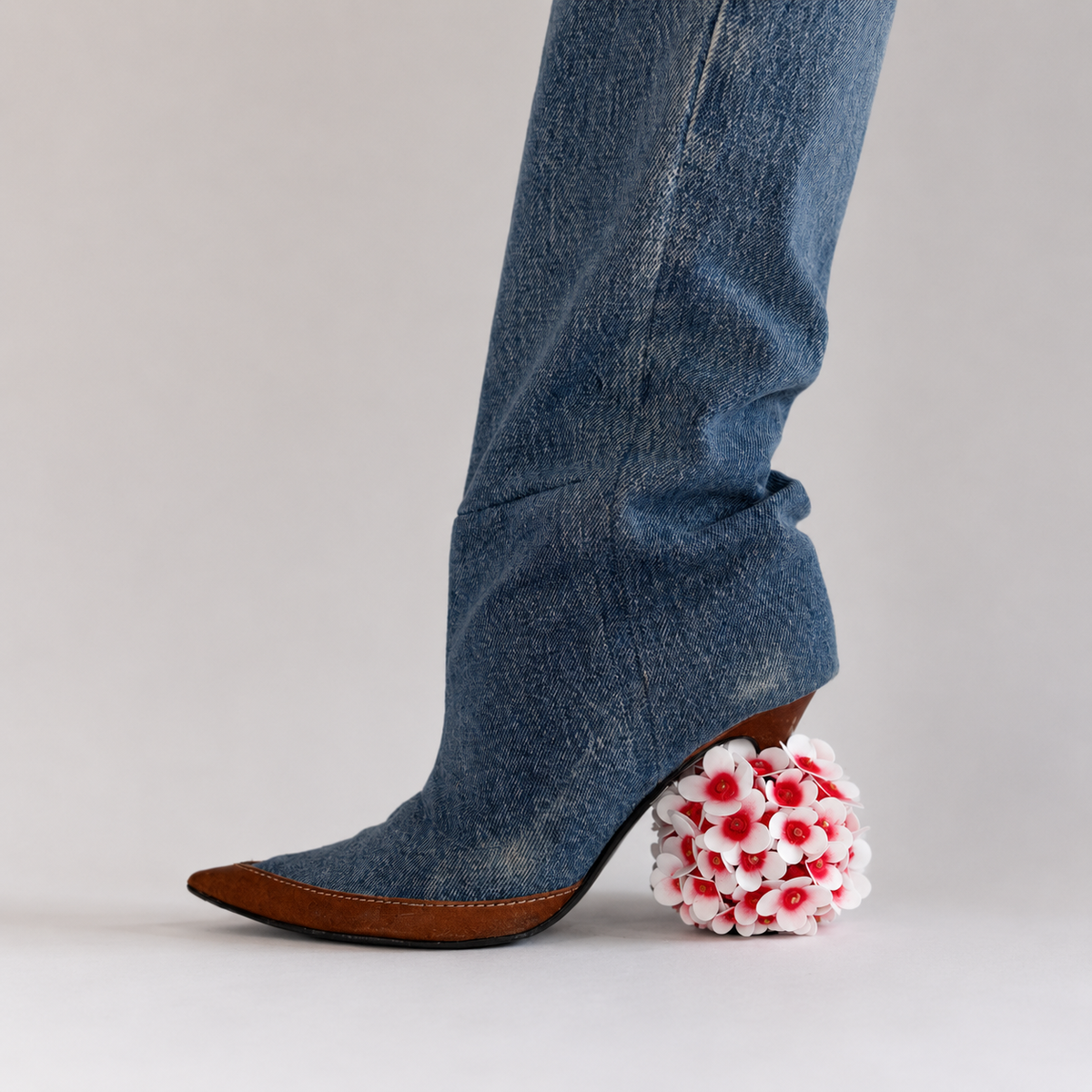 Red and white hydrangea heel jewel with red rhinestones fitted over a high heel